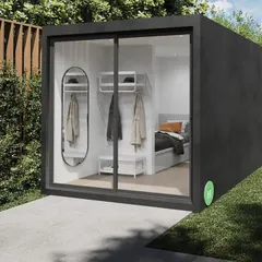 Our signature backyard pod is a versatile solution for adding extra space. This model, shown here with a sleek black frame and sliding glass wall, can be installed in just two months and serves perfectly as a home office, gym, or private studio.