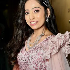 A close-up of this stunning reception bride. We went for a fresh, dewy glam with soft pink eyeshadow and a radiant complexion that looks incredible.