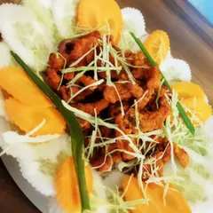 Try our special Pork Bhujiya, a crispy and savoury dish. Thinly sliced pork is fried until crunchy and garnished with fresh vegetables, making it a very addictive snack.