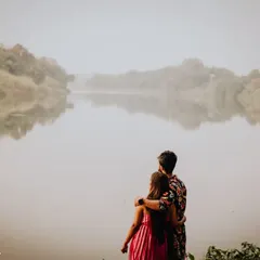 A quiet, misty morning by the lake. This pre-wedding shot captures a feeling of peace and togetherness, just the two of them against the world.