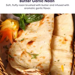 This soft, fluffy Butter Garlic Naan is brushed with butter and infused with aromatic garlic flavour, a perfect companion to any dish.