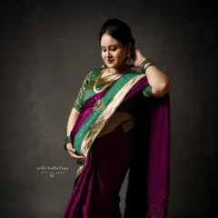 A gentle, downward glance, showcasing the beautiful details of the saree and traditional jewelry. These are portraits rich in culture and emotion.