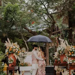 A romantic moment under an umbrella during a rainy day shoot in Udaipur. The weather just added to the cozy, intimate vibe.