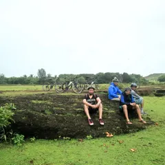 Taking a break on a rocky outcrop amidst the lush green fields of Gokarna. The monsoon season turns the entire landscape into a vibrant paradise.