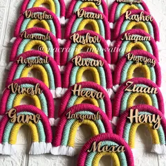 A full set of personalized rainbow magnets ready to be packed. I can create these with any name, making each gift truly special for your guests.