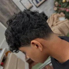 Another angle of the taper fade, showing how it cleanly shapes the neckline. This kind of precision work is key to a long-lasting, great-looking men's haircut.