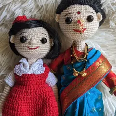 A beautiful custom set featuring a mother and daughter. The doll in the red dress was made to resemble the client's 'jija' (sister-in-law).