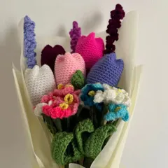 A beautiful handmade bouquet that will never wilt. This arrangement features a mix of colorful tulips, delicate forget-me-nots, and lavender, all crocheted by hand and wrapped beautifully, making it a perfect everlasting gift.