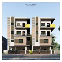 "The Twin House" in Kogilu, designed as two mirrored homes on a 60x40 plot. The facade uses vertical grooves and stone cladding to create a unified yet distinct look for each residence.