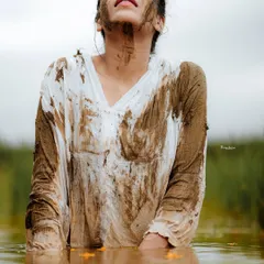 An expressive portrait from the paddy field series, focusing on the model's connection with the natural environment.
