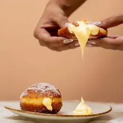 The perfect money shot. Our Custard Berliner, oozing with silky smooth pastry cream, is ready for its close-up and is guaranteed to make your weekend better.