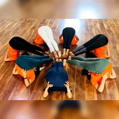 More fun with group yoga formations! These images capture the playful spirit and strong bonds forged in our training programs. It's all about connection and support.