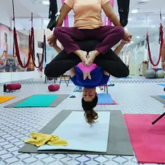This playful inversion in the aerial hammock is a great way to build confidence and experience the benefits of being upside down without any pressure on the neck or spine.