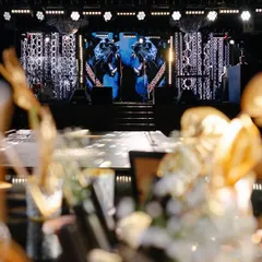 The stage is the heart of the party. Here, the panther motif comes alive on dynamic LED screens, framed by intricate patterns and powerful spotlights. This isn't just a backdrop; it's a living part of the celebration's energy.
