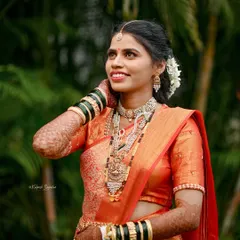 Another angle of this beautiful bride's look. The shoulder pleats are neatly pinned to stay secure through all the wedding rituals, and the front pleats fall gracefully.
