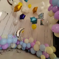 A simple yet sweet decoration for a small space. This pastel balloon garland is mixed with star and moon shaped foil balloons, perfect for a "Twinkle Twinkle Little Star" theme at home.
