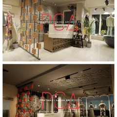 This image shows the transition from the 3D design to the finished reception area, highlighting the accurate execution of the custom screen, desk, and intricate background mural.