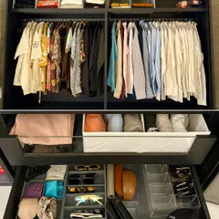 This composite image shows a man's wardrobe with hanging shirts above and a detailed look into a drawer organized with custom inserts for ties, sunglasses, and other essentials.