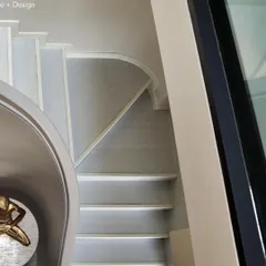This angle shows how the sculptural staircase in the Agra Fort Project interacts with the surrounding space. It’s not just a way to get from one floor to another; it’s a central design feature of the home.