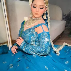 This elegant pose shows the full look of the blue Anarkali, a great rental option for a wedding guest or bridesmaid.