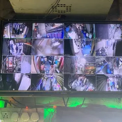A 16-camera view monitoring a busy market area in Chandni Chowk. Our systems are built to handle high-traffic commercial environments.