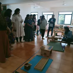 A parent orientation session in progress. These meetings are vital for bridging the gap between home and school, helping parents understand the Montessori method and their child's experience.