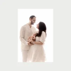 The color version of the new family portrait. The warmth of their connection is beautifully captured in this bright, high-key studio shot.