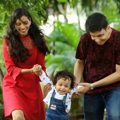 Capturing the joy of a baby's first steps with mom and dad. Our outdoor park sessions are perfect for these candid, action-filled moments that show the family's natural interaction.