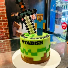 A birthday cake for a Minecraft fan, featuring the game's iconic blocky aesthetic. This design includes a fondant Steve figurine and a pixelated sword, ready for an adventure.
