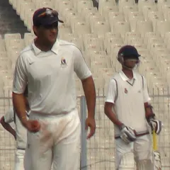 A memory from my professional career during the 2011-12 Ranji Trophy season. Here I am on the field at Eden Gardens during a Delhi vs Bengal match with the legendary Sourav Ganguly. This experience at the highest level of domestic cricket shapes the professional standards I bring to my coaching.