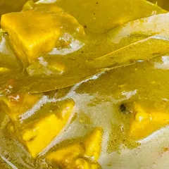 A close-up of our creamy Palak Paneer. We use fresh spinach and soft paneer cubes, cooked in a rich, flavorful gravy with whole spices like bay leaf.