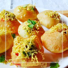 A close-up of our perfectly crisp Dahi Puri, a variation of the classic Gol Gappa. Each puri is filled with delicious stuffing and topped with sev, showcasing the versatility and multiple variations we offer at a single event.