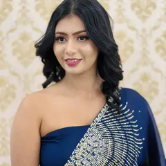 A candid shot showing off this elegant party makeup. The soft waves in her hair and the flawless skin finish create a look that is both sophisticated and effortlessly beautiful.
