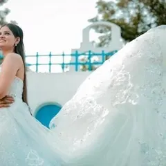 The long, flowing train of our white lace gown creates a beautiful sense of movement. This dress is perfect for capturing those magical, wind-swept pre-wedding shots.