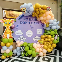 Photo booths add so much fun to a party. For this "No Hair, Don't Care" Mundan celebration, I created a playful backdrop with a large circular sign, cute graphics, and a colorful balloon garland, giving guests a fun spot to capture memories.