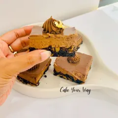 A close-up of my Bournvita Milk Bar, a nostalgic treat for anyone who grew up with the flavor. It has a crunchy biscuit base, a creamy Bournvita-infused mousse, and a smooth chocolate topping.