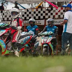 Amateur riders on their Ather electric scooters, lined up and ready for their track training session. We provide guidance to ensure everyone, even first-timers, can race safely.