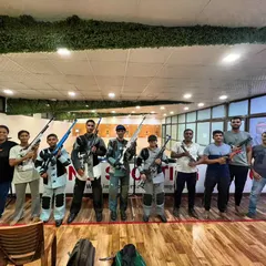 The whole team, standing proud with their rifles and pistols. This sport gives you a unique identity and a community for life.