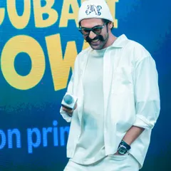 A candid moment from the Kingdom of White shoot with Rana Daggubati. The monochromatic styling looks effortlessly cool on stage, proving that all-white is a powerful choice for public appearances.