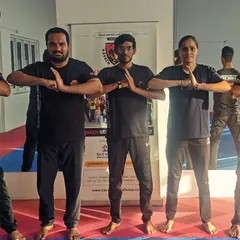 A group of newly certified instructors welcomed into the Kavach family, their bonds forged in sweat and trust.