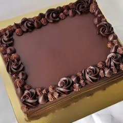 A rich chocolate ganache sheet cake is a crowd-pleaser for any office occasion. It provides a large surface for custom messages, like the one I made to celebrate a YouTube milestone.