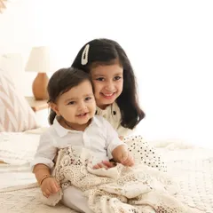 A sweet cuddle between siblings. The gentle embrace and happy smiles say it all. I aim to capture the natural affection between children in a simple, beautiful way.