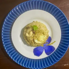 A healthy twist on a classic: my Millet Chicken Biryani. Cooked like a traditional Malabar pulao, this dish uses nutritious millet instead of rice, infused with delicate spices and served with boiled eggs. It's light yet incredibly flavorful.