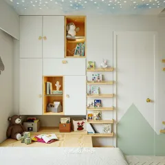 A close-up of the integrated storage in this kids' room. The combination of closed cabinets and open, wood-lined niches is perfect for hiding clutter while displaying favorite toys and books.
