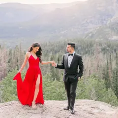 A romantic moment from a pre-wedding shoot in the mountains. The client is wearing my simple yet elegant red slit gown, which adds a beautiful pop of color to the natural scenery.