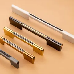 An assortment of metallic and matte finish handles. This shot effectively displays a full product line, showing the different sizes and finishes available.