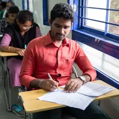 A student focused during a written examination. Our certification process is thorough and prepares learners for international language tests.