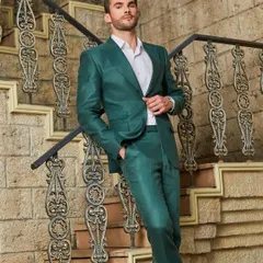 The vibrant green linen suit, seen here on a grand staircase. The sheen of the fabric and the impeccable tailoring create a look of effortless luxury, perfect for a stylish getaway.