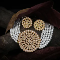 Our lifestyle jewellery photography places your pieces in an elegant, natural setting, capturing the texture of the pearls and the warm tones of the gold to create an aspirational image.