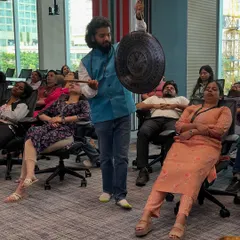 This is the power of a sound bath, right in the workplace. I am using a traditional gong to wash away the stress of the day for the team at 7-Eleven in Bangalore. The vibrations help reset the mind and body, even when you are sitting in an office chair.